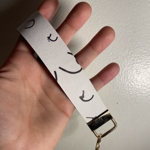 White breast awareness wristlet keychain